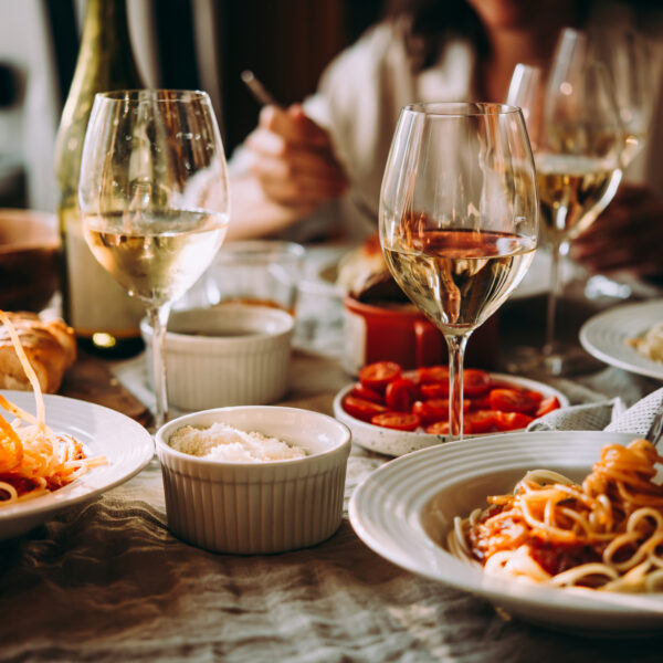 Friends,Having,A,Pasta,Dinner,At,Home,Of,At,A