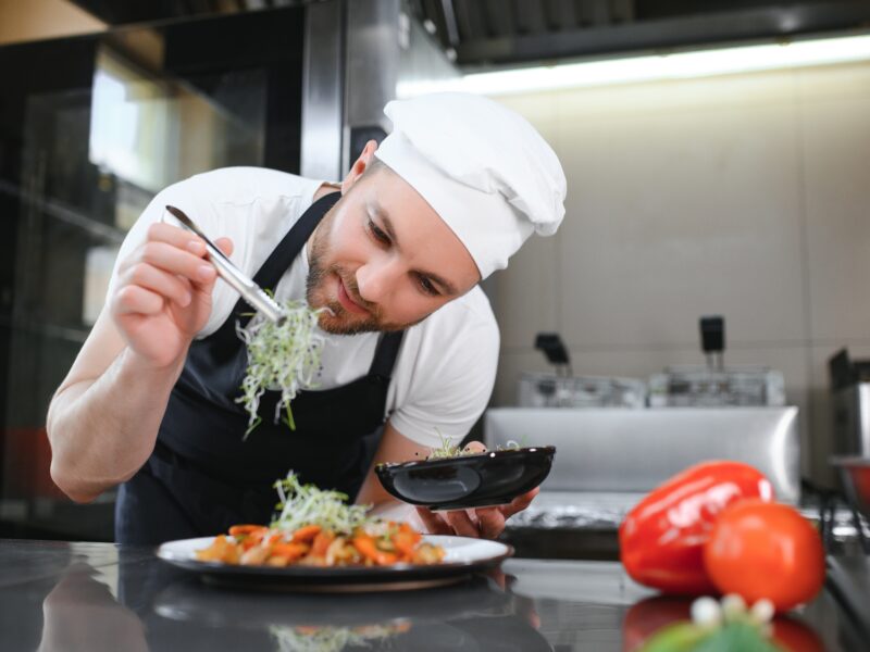Portrait,Of,Happy,Caucasian,Male,Chef,Standing,In,Restaurant,Kitchen,