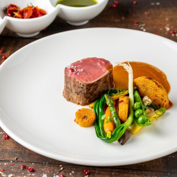 Filet,Mignon,Served,With,Vegetables,And,Sauces,At,A,Fine