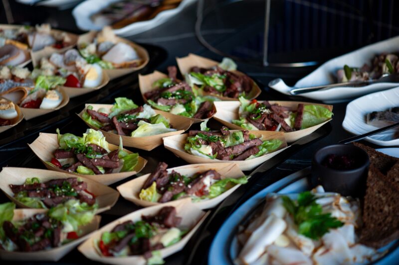 Catering,Assortment,Of,Gourmet,Appetizers,On,Dark,Serving,Plates,,Fresh